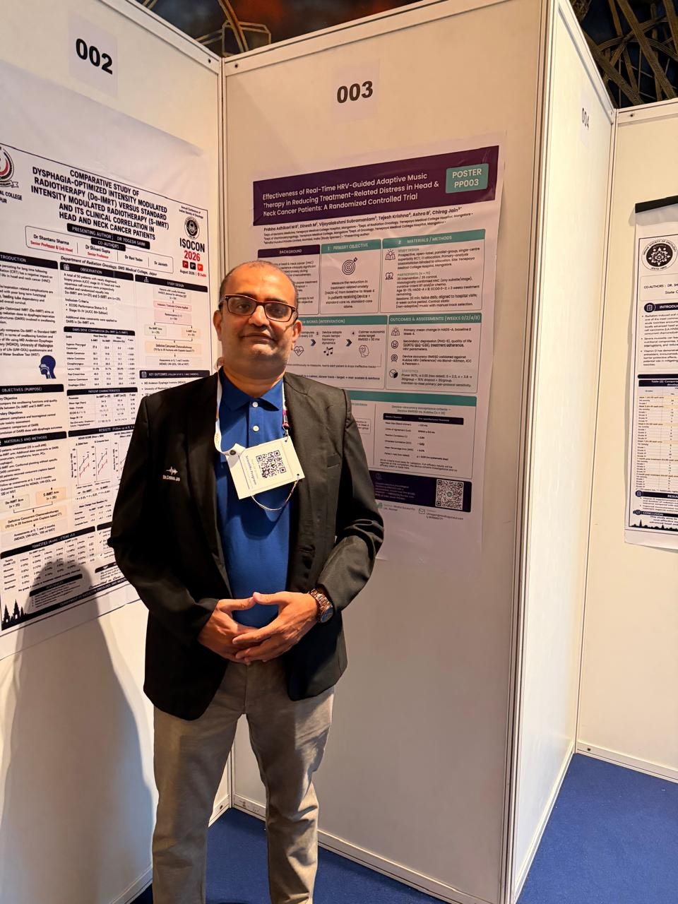 Dr. Chirag B. Jain alongside his research poster on the ongoing randomised controlled trial investigating real-time HRV-guided adaptive music therapy for treatment-related distress in patients with head and neck cancer.
